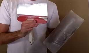 guy holding Drywall Hawk and Mud Pan