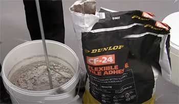 guy mixing Dunlop tile adhesive